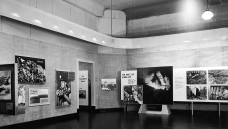 This photo shows a room at the National Gallery of Canada, the walls covered with large photographs illustrating sectors of Canadian industry. Ottawa, Ontario, March 1945.