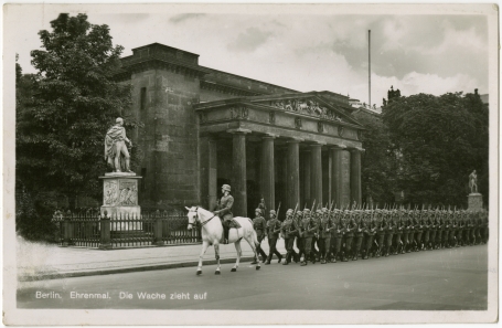 A postcard showing the memorial to German victims of the First World War in Berlin. Nazi soldiers march solemnly past it, preceded by a mounted officer.