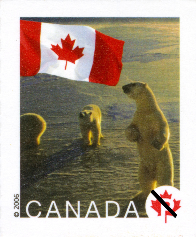 This postage stamp reproduction shows a group of three polar bears. The Canadian maple leaf flag decorates the upperleft corner of the stamp.