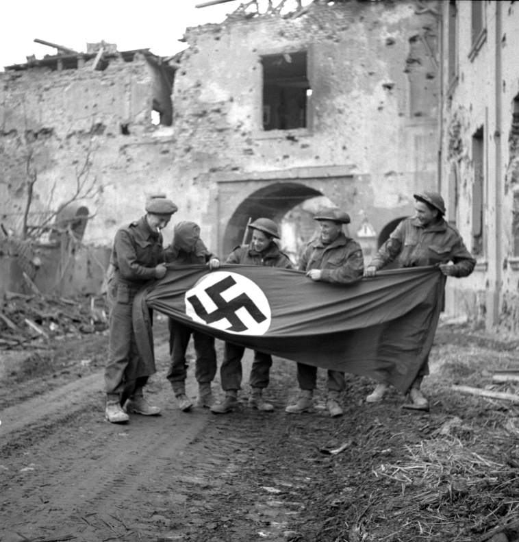Canadian Soldiers Display a German Flag