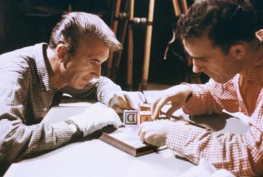 Photograph of Norman McLaren and Grant Munro working on the opening sequence of the film Canon, made in 1964.