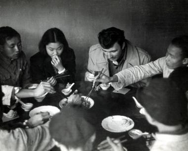 Norman McLaren shares a meal during his China trip in 1949.
