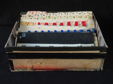 Box containing 63 cards used in the production of synthetic music on film stock.
