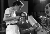 Claude Jutra and Norman McLaren screening sequences from the film A Chairy Tale on a Moviola editor.