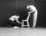 Norman McLaren and Evelyn Lambart attache the invisible nylon line that will be used to animate the chair.