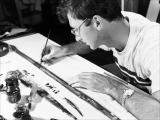 Norman McLaren draws directly on film using a fountain pen and India ink.