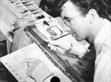 Norman McLaren draws in pen and India ink directly on 35 mm film stock using direct animation or cameraless animation technique.