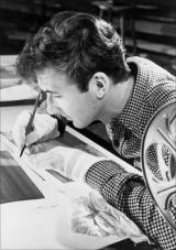 Norman McLaren draws in pen and ink directly on the sound track of 35 mm film stock.