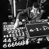 McLaren chooses variations of the paper numerals and symbols required for his unfinished film One, Two, Three.