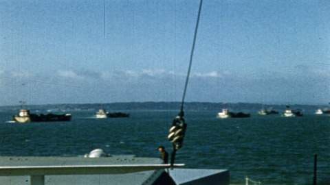 Colour footage : Two LSs of invasion fleet crossing English Channel, MS of same. Individual and PAN shot of entire fleet in channel on their way to France (06/06/1944 or 07/06/1944).